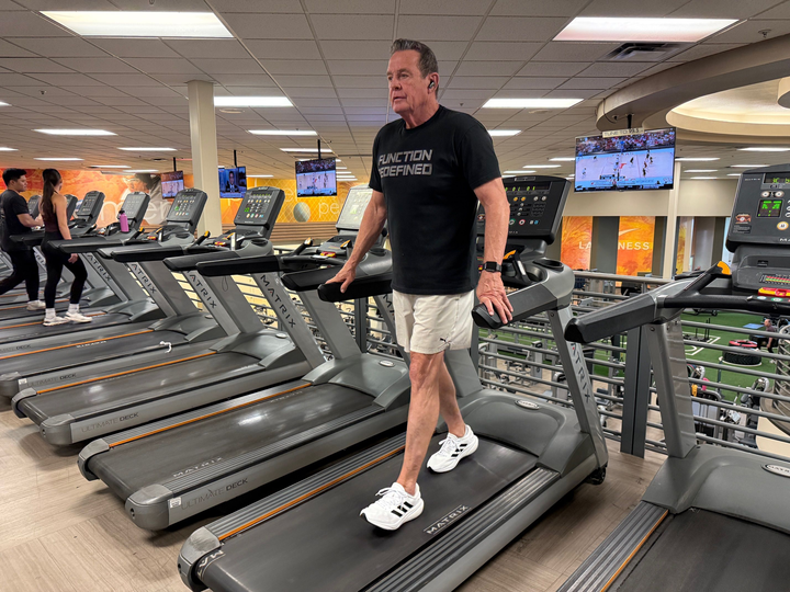 Backward walking activating posterior chain muscles including glutes, hamstrings, and lower back.