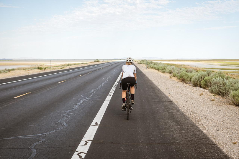 Person cycling on a road