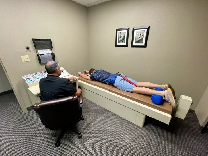 Patient doing spinal decompression therapy using VAX-D for a herniated disc at our Mesa, AZ office.